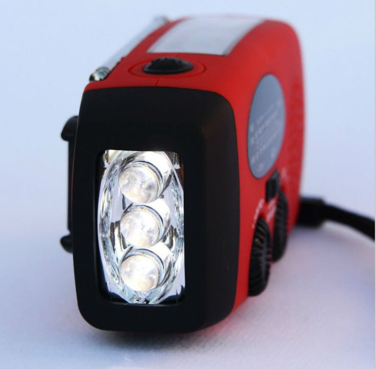 Solar hand crank USB charging radio flashlight - Dot Com Product